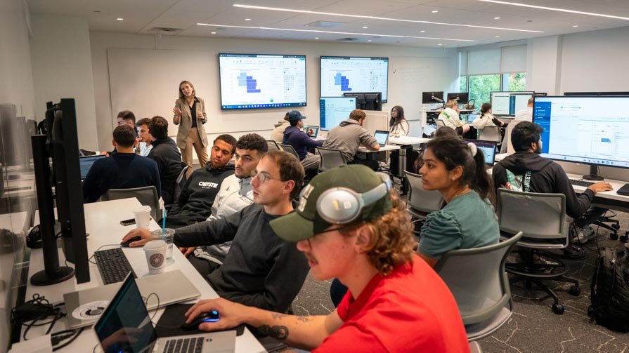 Assistant Professor of Information Systems and Analytics Geri Dimas teaches a course in Bryant University's new Data Visualization Lab